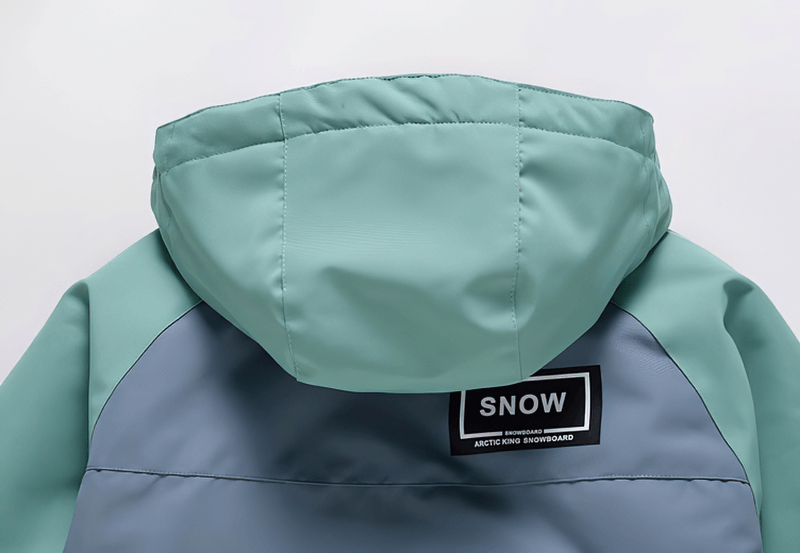 Back view of hooded waterproof snowboarding jacket with double zipper in teal and grey, featuring a logo patch.
